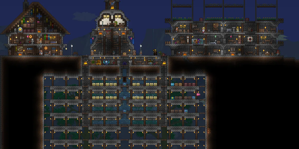 Ночная база в Terraria с освещённым хранилищем и рядами сундуков